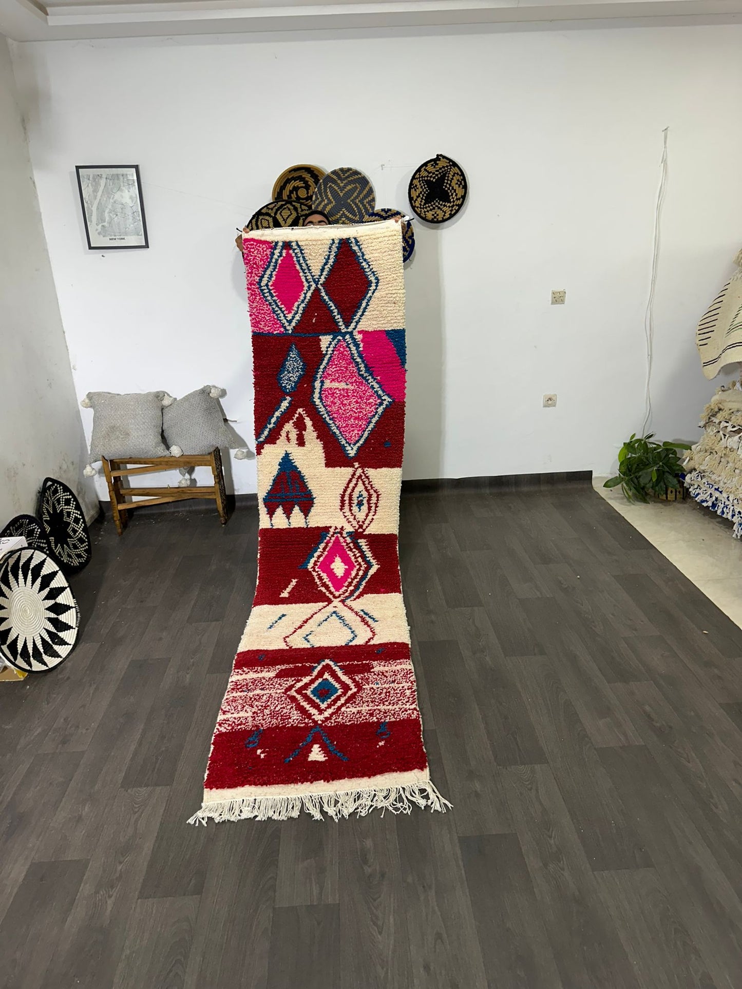 Decorative rug with geometric pattern on a wooden floor