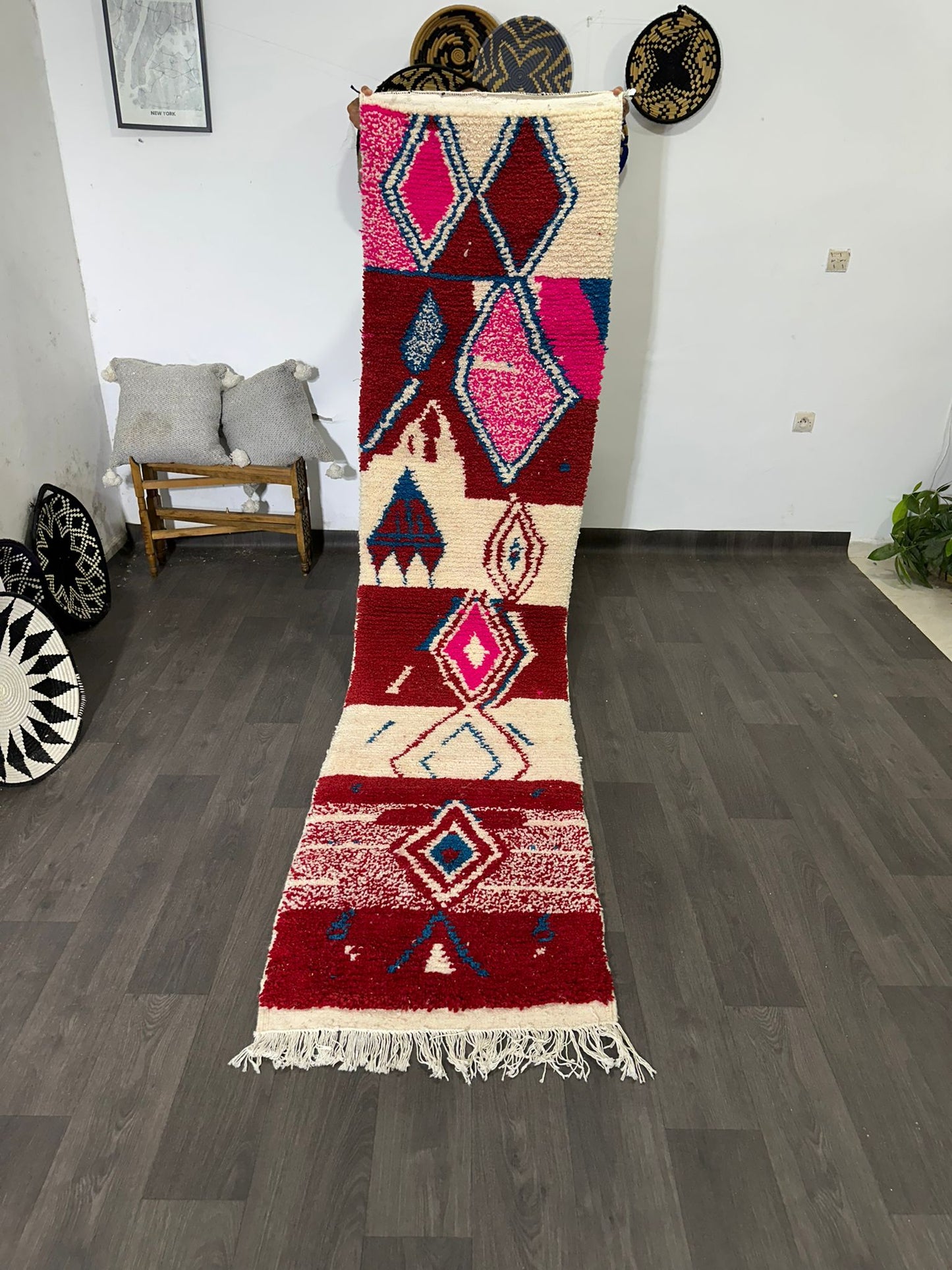 Decorative rug with geometric pattern on a wooden floor