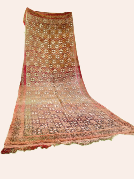 light orange/red vintage Moroccan rug with cream symbol pattern