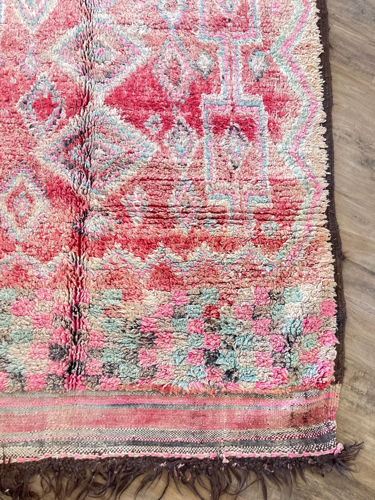 Red vintage Moroccan rug with pink and blue tribal design