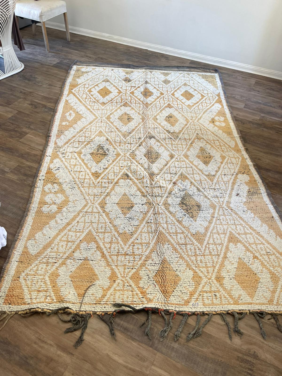 Vintage Moroccan Rug with light orange background and cream pattern