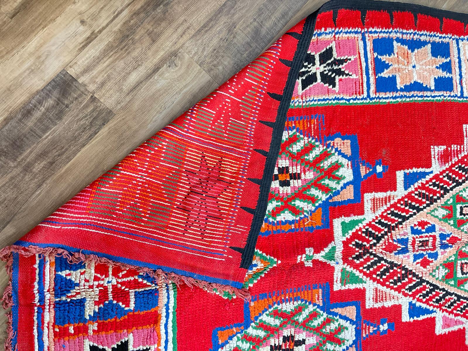 Red Moroccan vintage rug with tribal multi-coloured designs