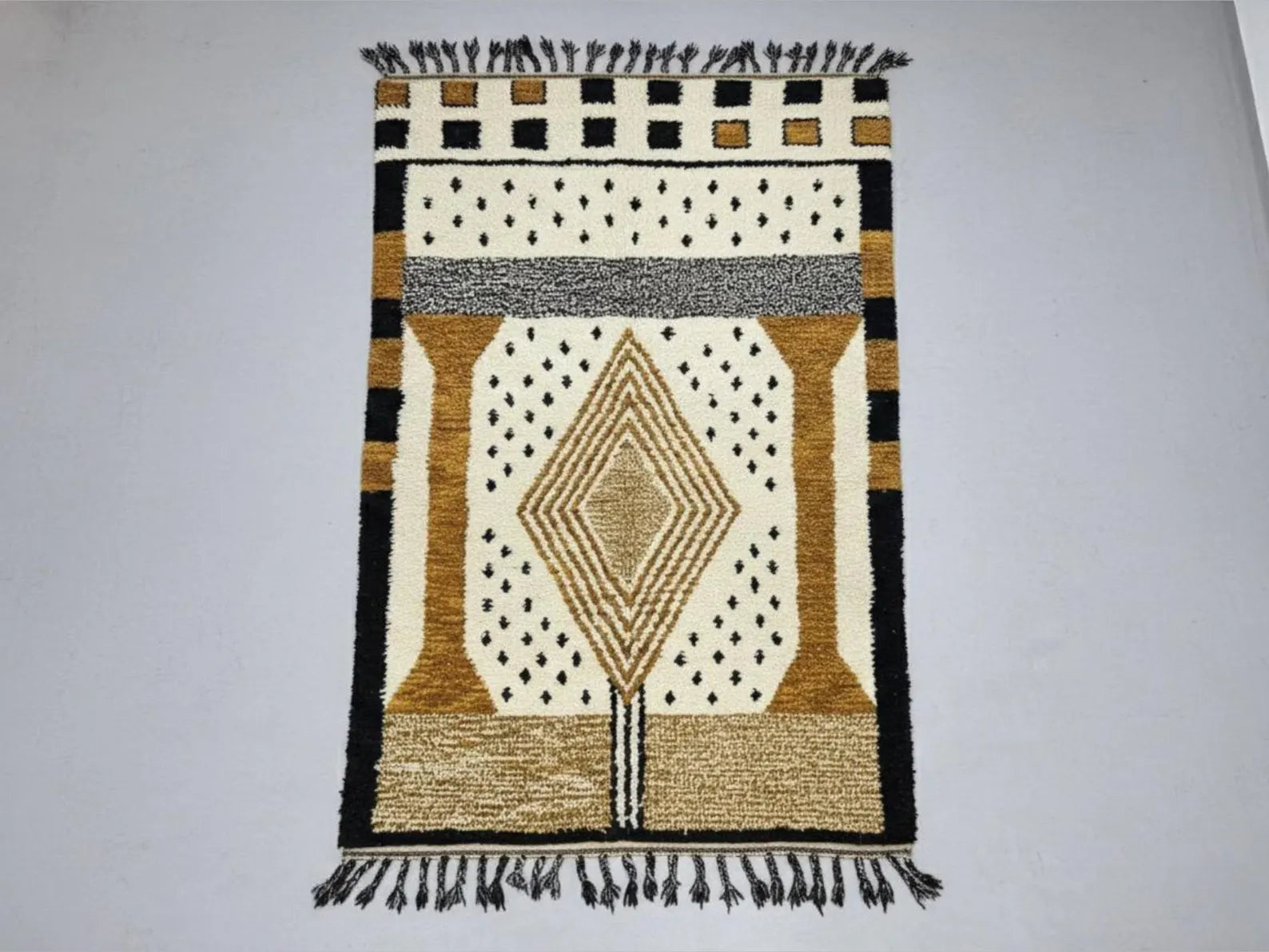 Decorative rug with geometric pattern on a plain background