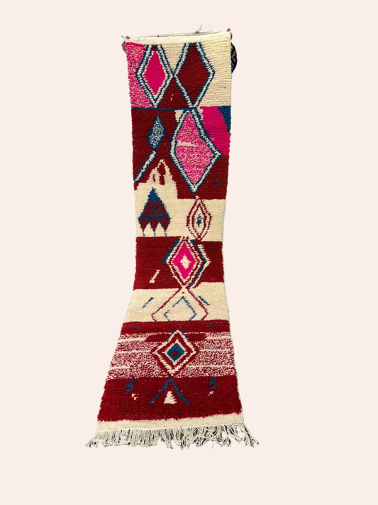 Decorative rug with geometric pattern on a wooden floor
