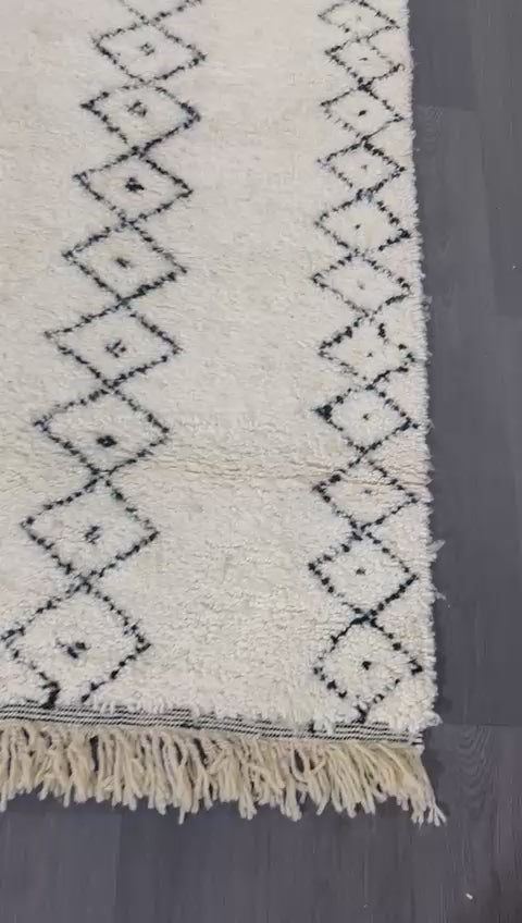 White Moroccan wool rug in video showing details