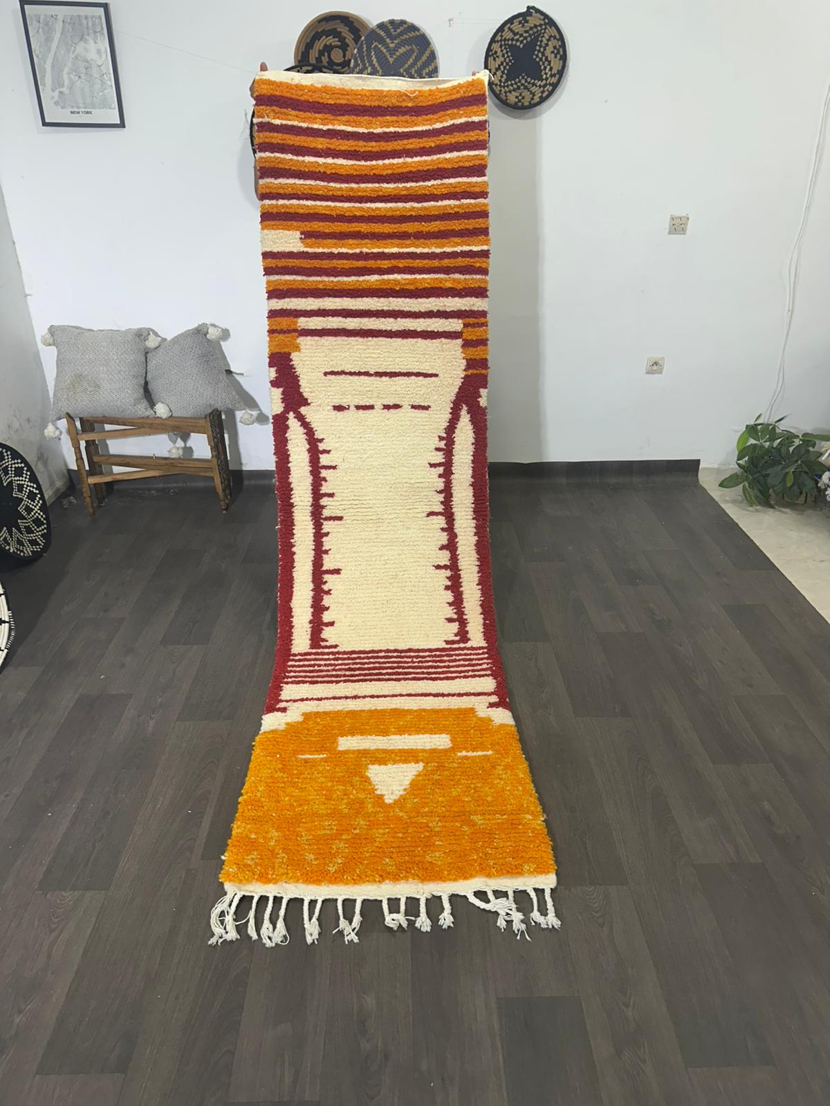 video of colourful striped wool rug on wooden background