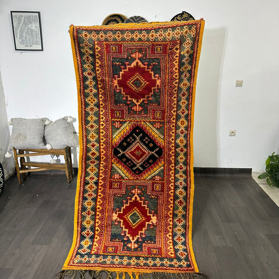 video of Vintage moroccan rug with geometric pattern on a wooden floor