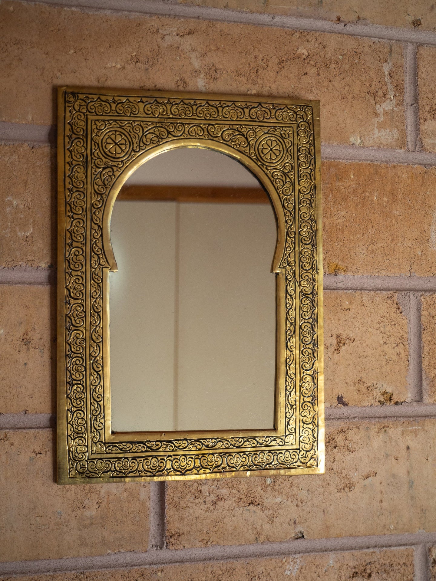 full view of the brass mirror